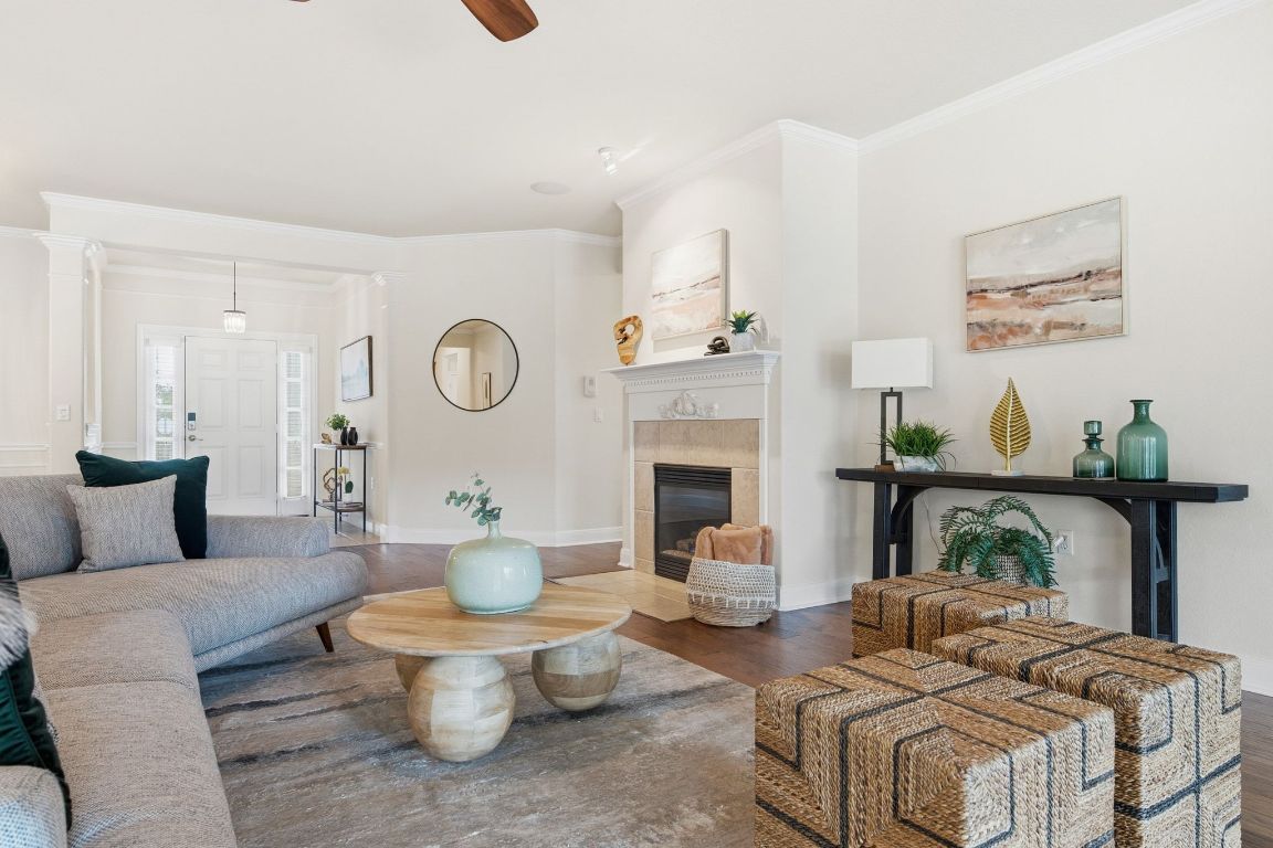 512 Armstrong Drive Georgetown, TX 78633 - Photo 9 of 40 a living room with furniture a fireplace and a potted plant