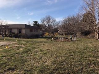 102 Fountainhead Road Portland, TN 37148 - Photo 3 of 10 a view of a yard with an house and a trees