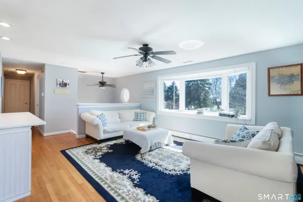 a living room with furniture and a large window