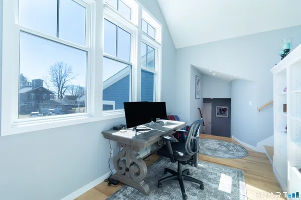 a workspace with furniture and a window