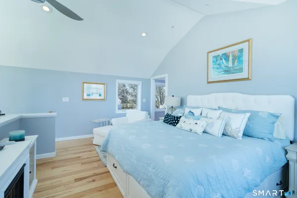 a bedroom with bed and a window