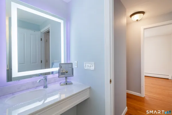 a bathroom with a sink and a mirror