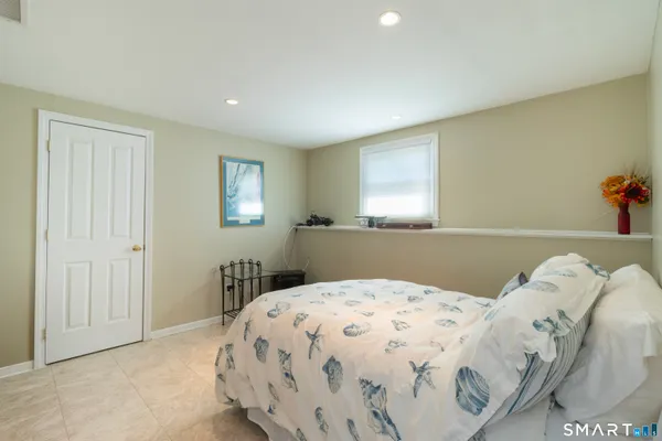 a bedroom with a bed and a table