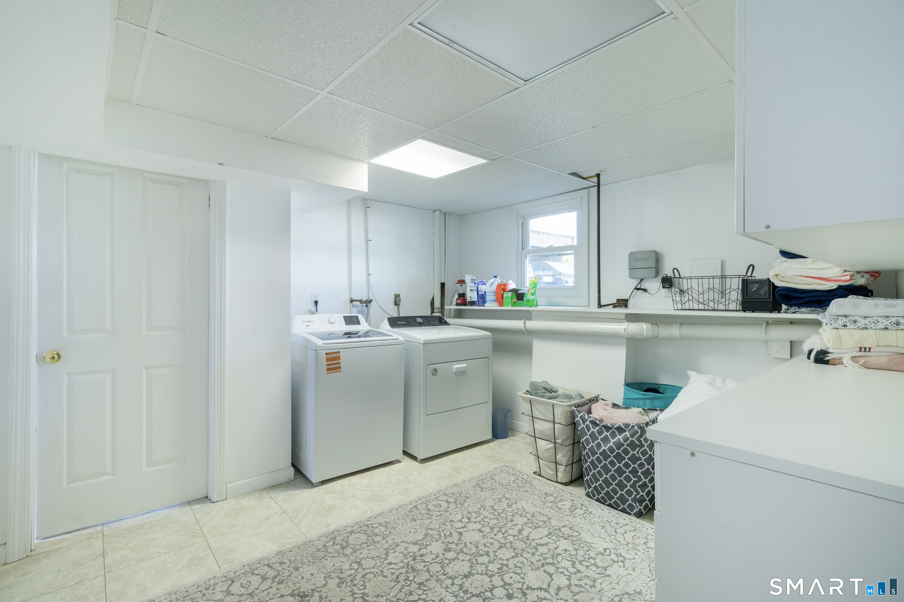 24 Indian Drive Clinton, CT 06413 - Photo 30 of 46 Full sized laundry room with storage.