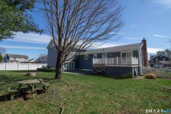 a view of house with a yard