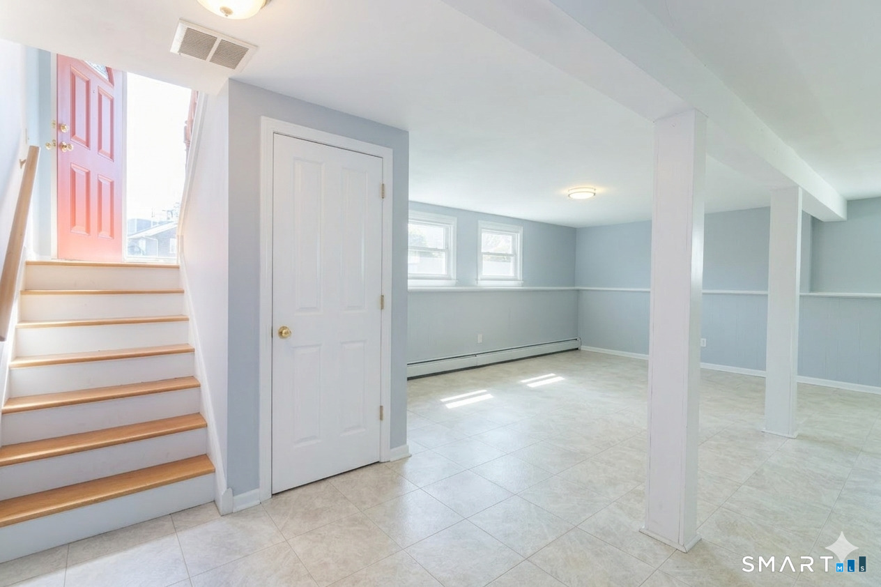 24 Indian Drive Clinton, CT 06413 - Photo 33 of 46 This very large space is ideal for a family room. It is also very bright with multiple full sized windows. See staging in the next photo.