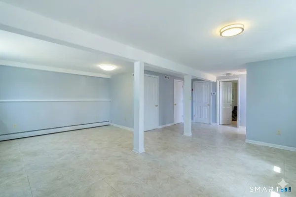 a view of an empty room with a window