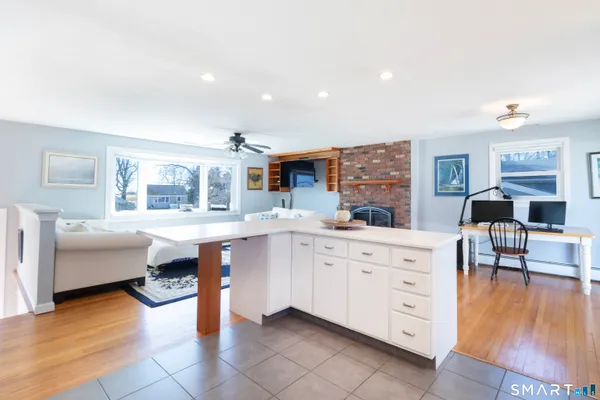a kitchen with stainless steel appliances granite countertop a sink and cabinets