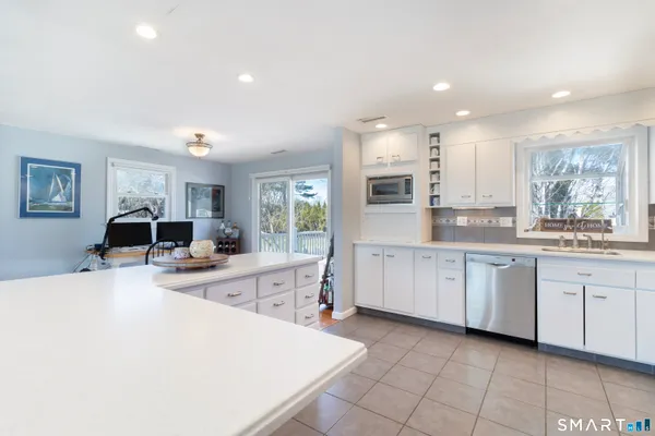 a kitchen with counter top space appliances and cabinets