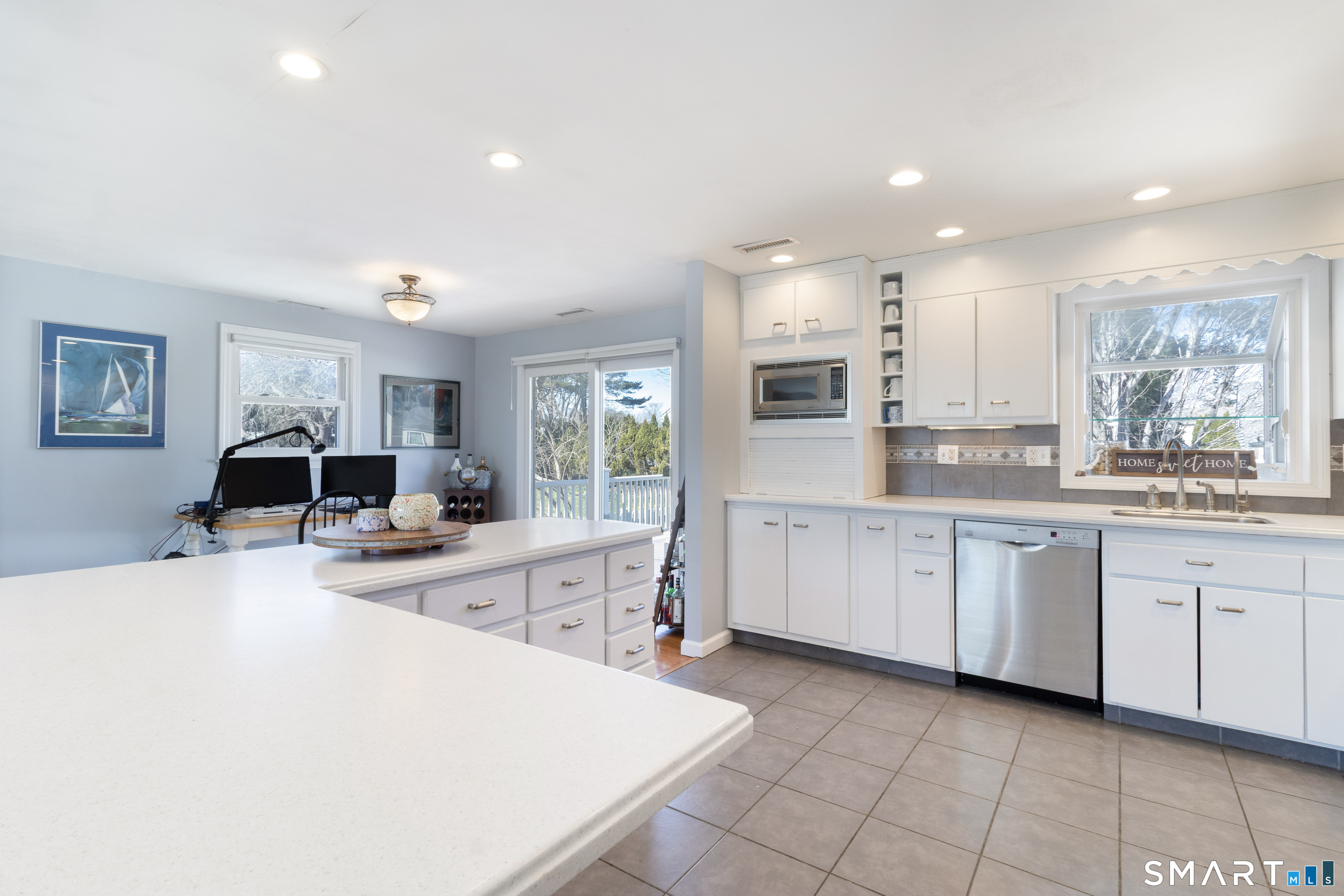 24 Indian Drive Clinton, CT 06413 - Photo 5 of 46 Kitchen has access to the back deck, fenced yard, and patio.