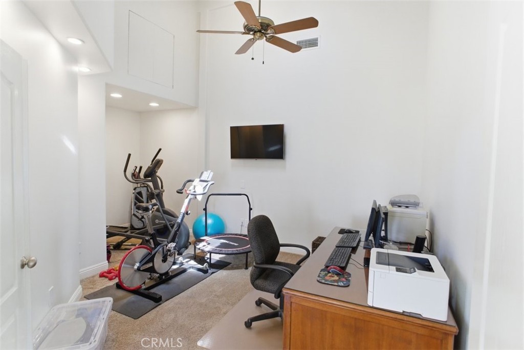 31233 Romero Canyon Road Castaic, CA 91384 - Photo 20 of 38 a view of a workspace with furniture and a mirror