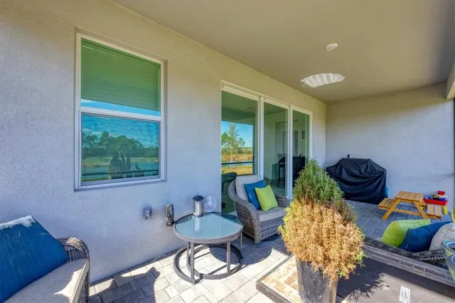 a view of a swimming pool and an outdoor space