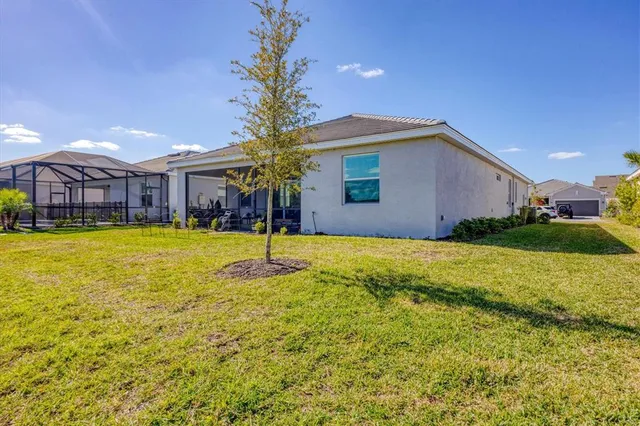 a view of living room filled with furniture and a potted plant