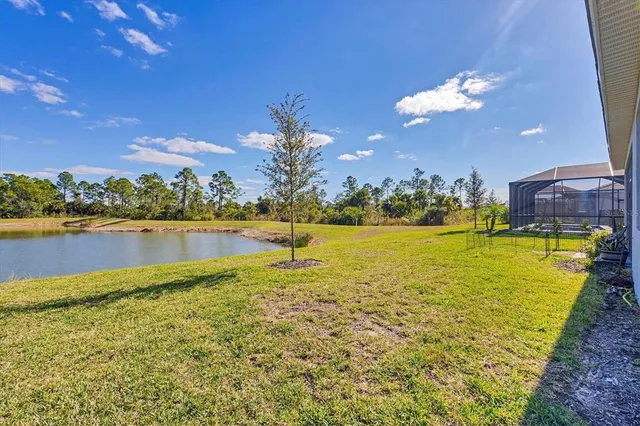 a view of swimming pool with an outdoor seating