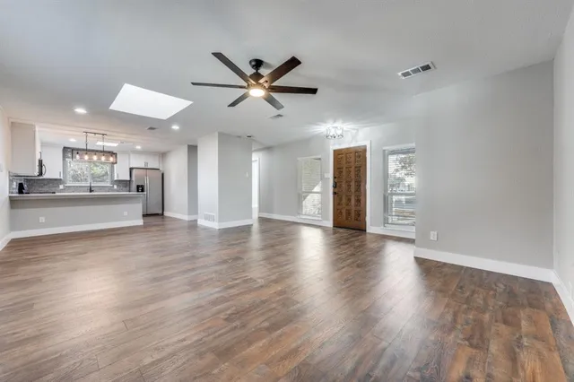 a view of a kitchen with a sink and a stove