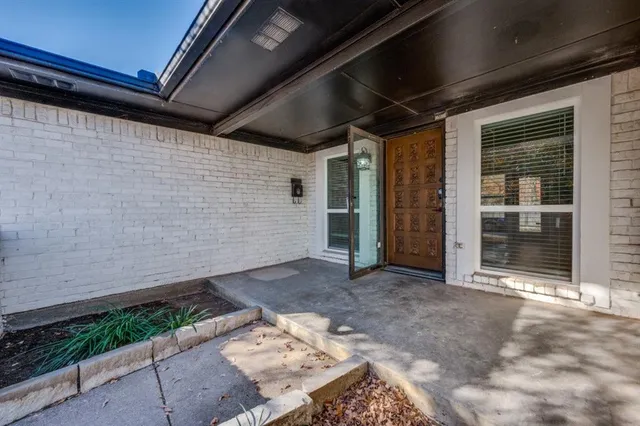 a view of backyard with wooden floor and window