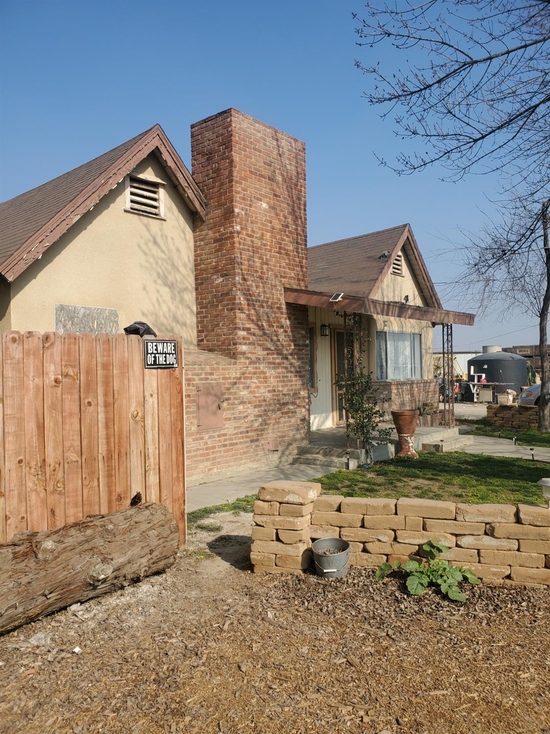 7517 Highway 145 Madera, CA 93637 - Photo 2 of 5 a front view of a house with garden