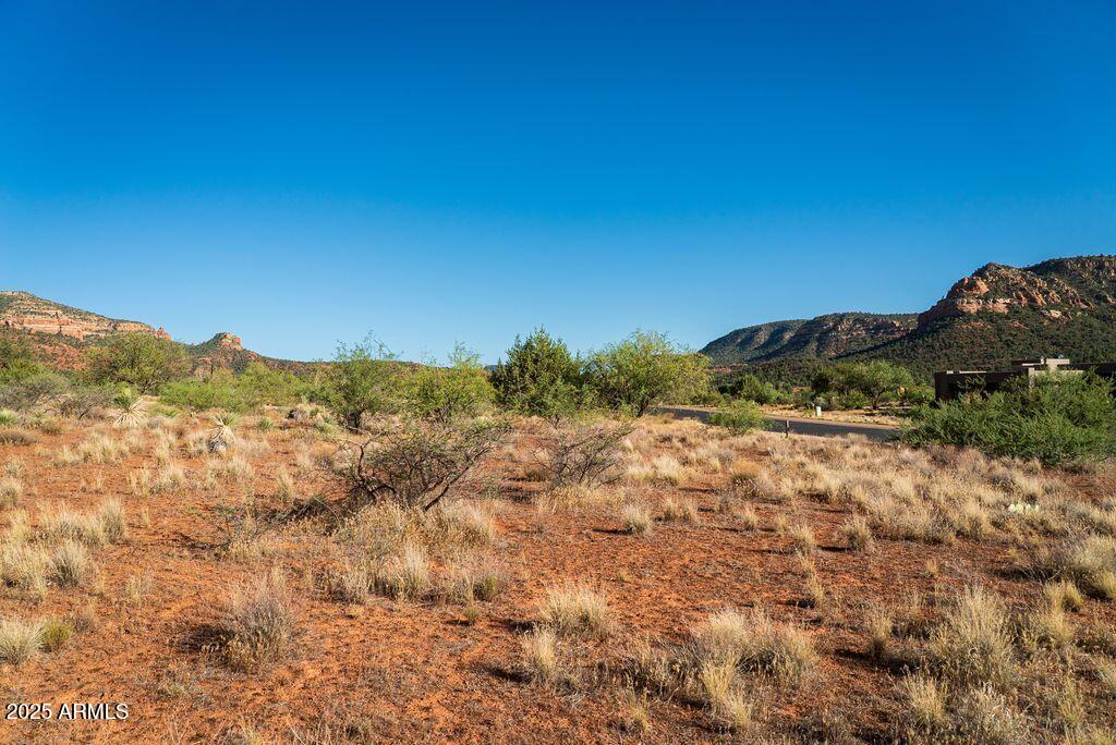 155 Cathedral Ranch Drive, Unit 83 Sedona, AZ 86351 - Photo 10 of 17 a view of a dry yard with mountains in the background