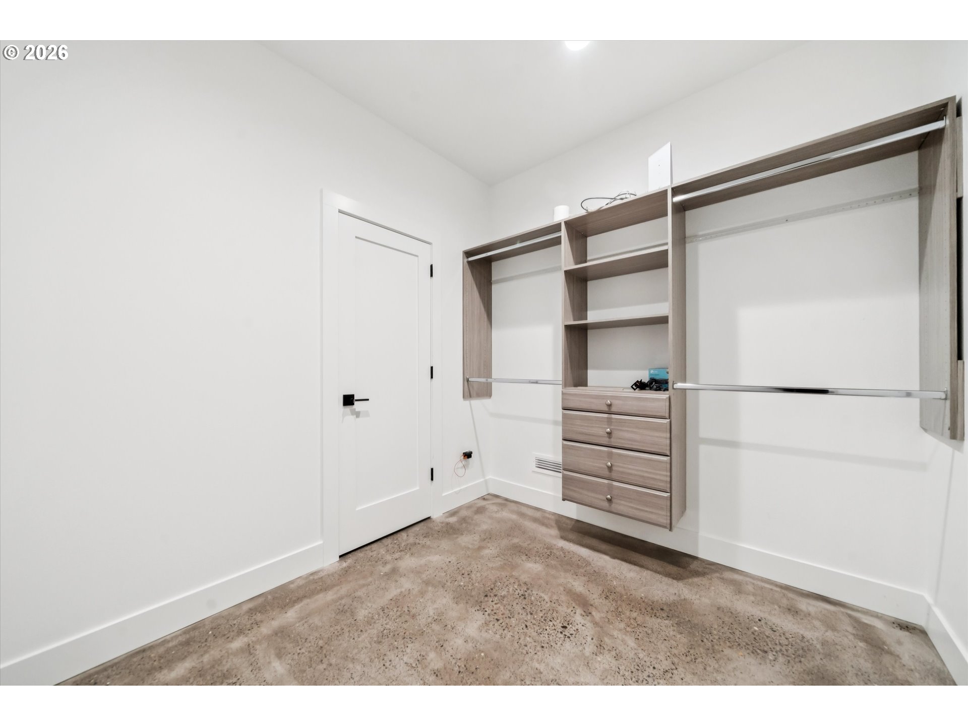 43815 Southeast Herrick Road Sandy, OR 97055 - Photo 14 of 35 a view of walk in closet with empty racks