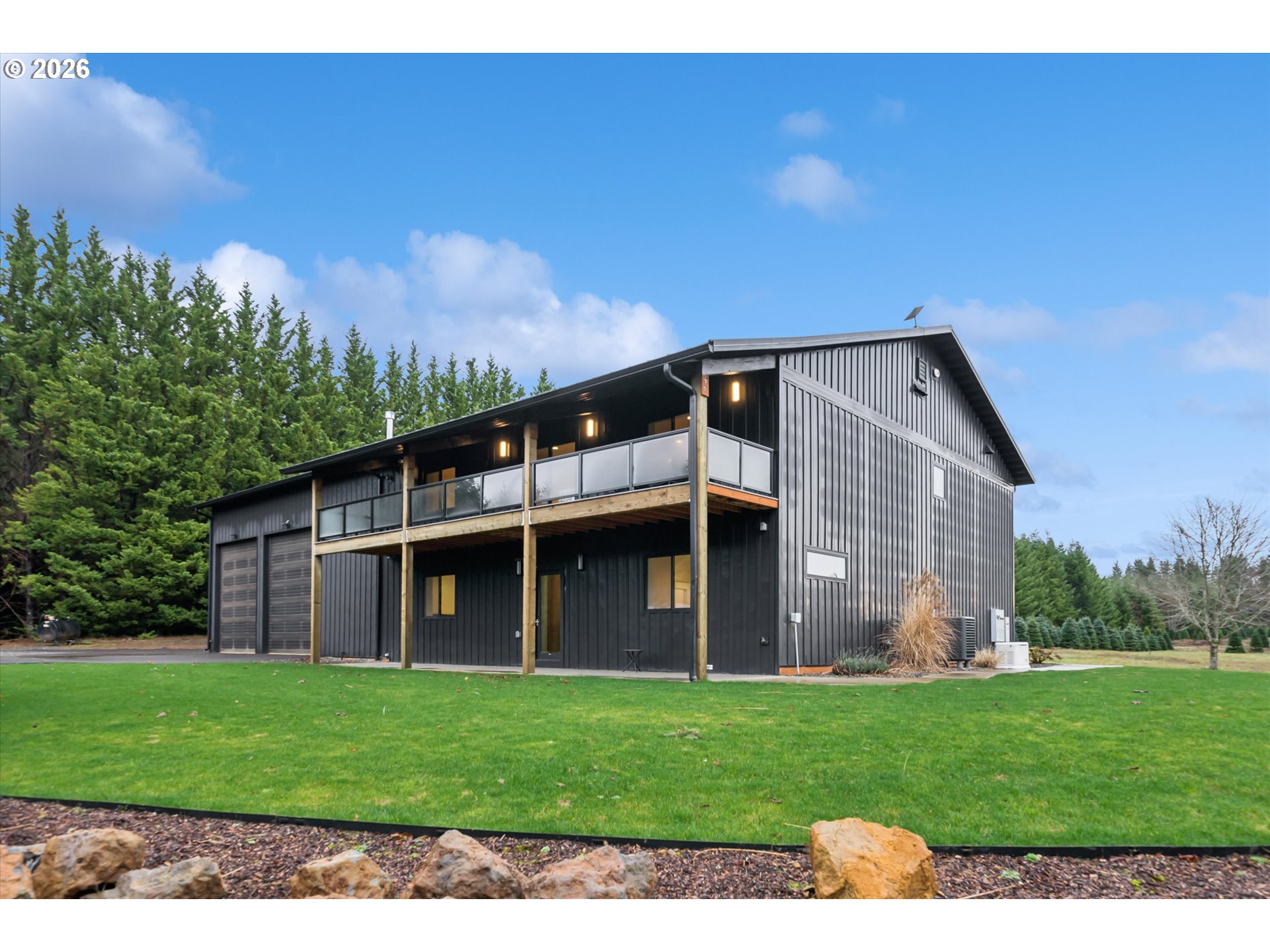 43815 Southeast Herrick Road Sandy, OR 97055 - Photo 26 of 35 a front view of a house with a garden and yard