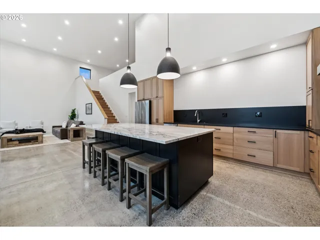 a kitchen with a table and chairs