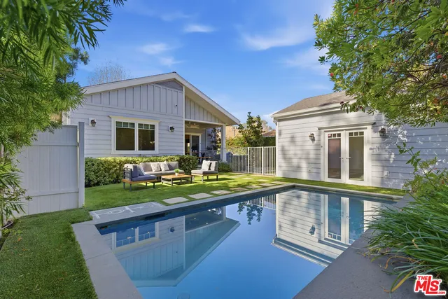 a front view of house with yard and outdoor seating