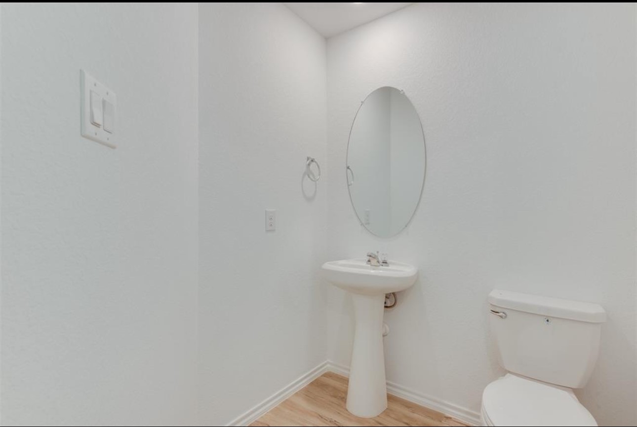 11020 South Lake Mist Lane Willis, TX 77318 - Photo 15 of 27 a bathroom with a toilet and a sink