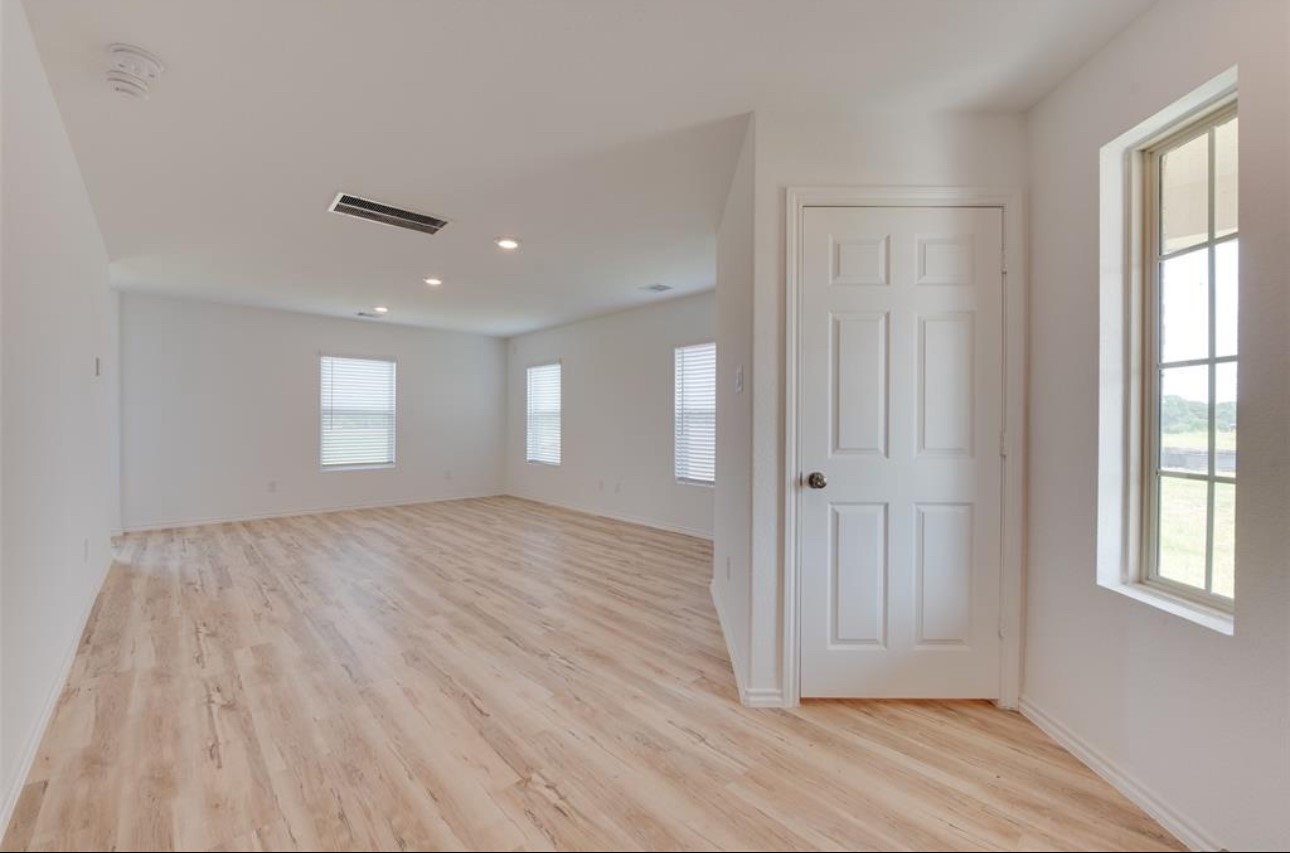 11020 South Lake Mist Lane Willis, TX 77318 - Photo 17 of 27 a view of empty room with wooden floor and fan