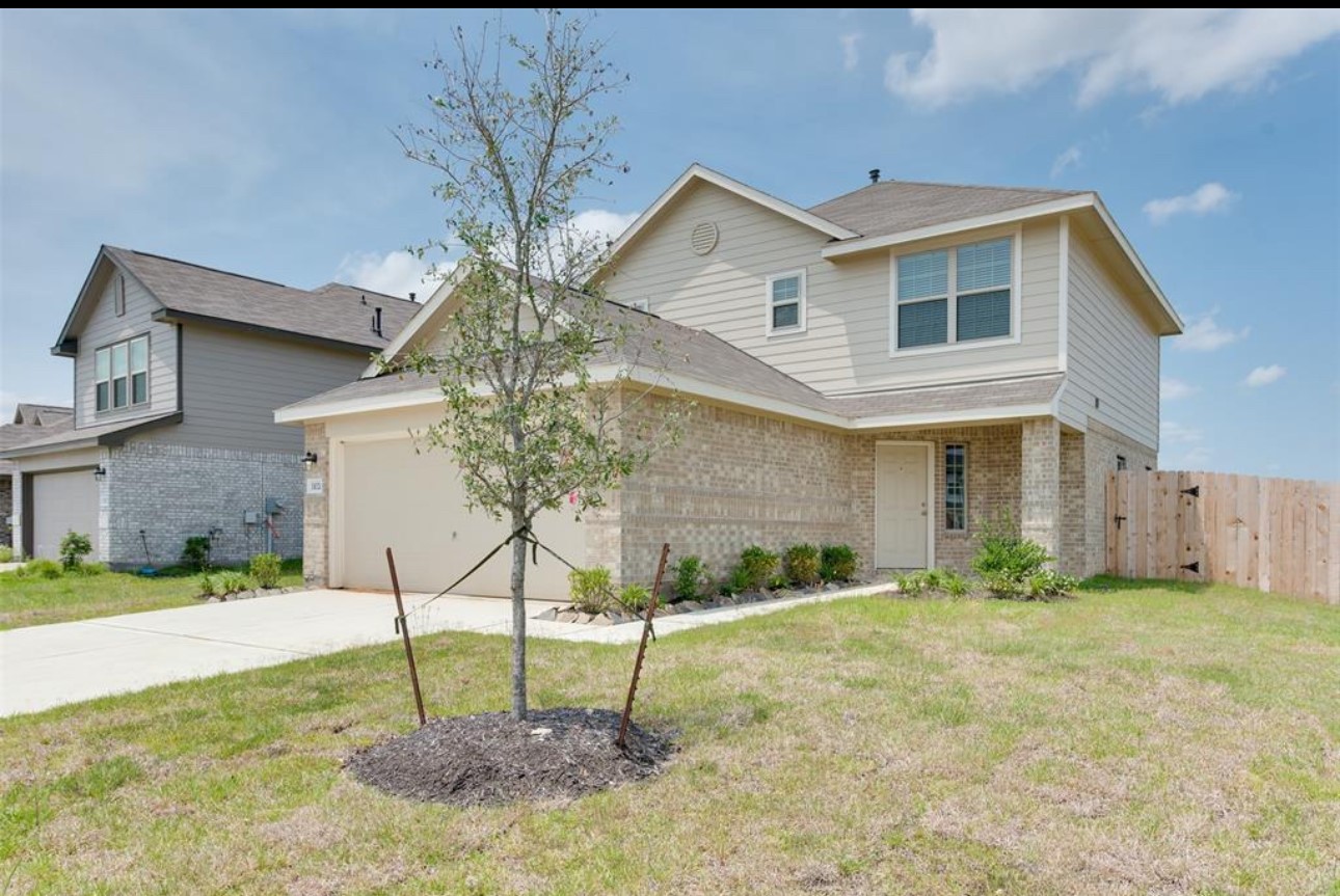 11020 South Lake Mist Lane Willis, TX 77318 - Photo 2 of 27 a view of a house with a yard