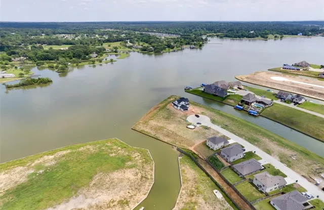 an aerial view of houses with outdoor space