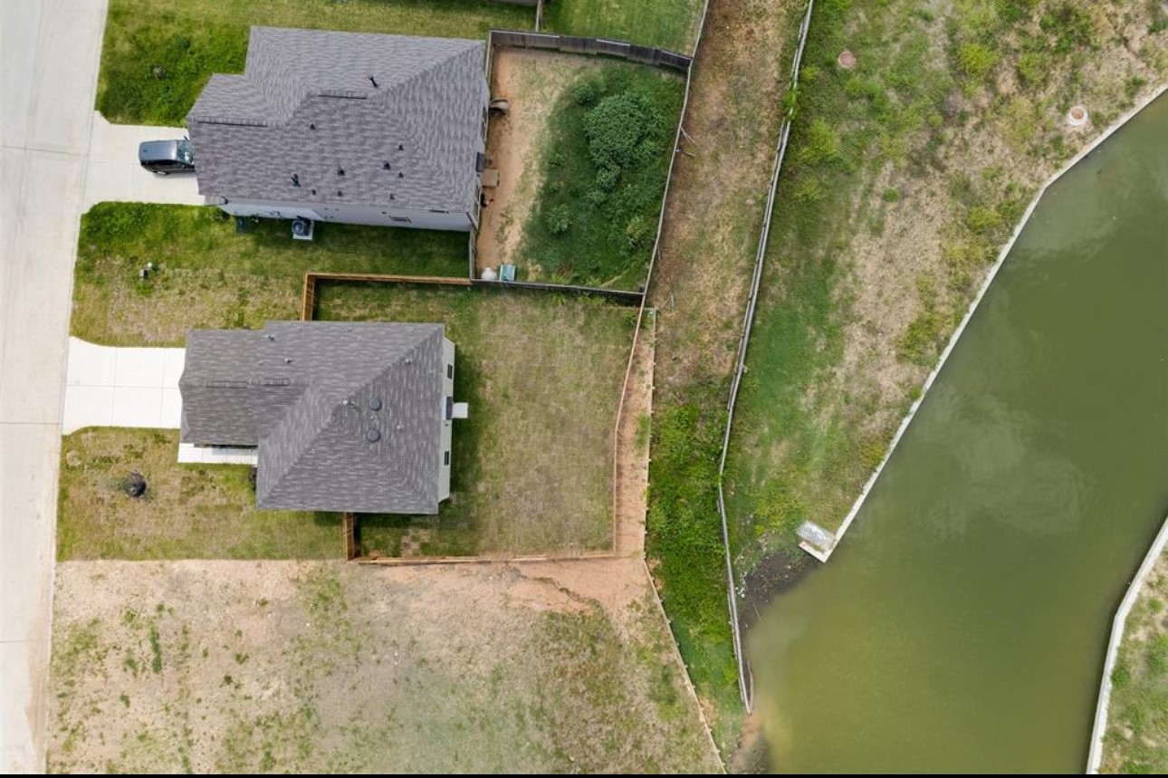 11020 South Lake Mist Lane Willis, TX 77318 - Photo 23 of 27 an aerial view of houses with outdoor space