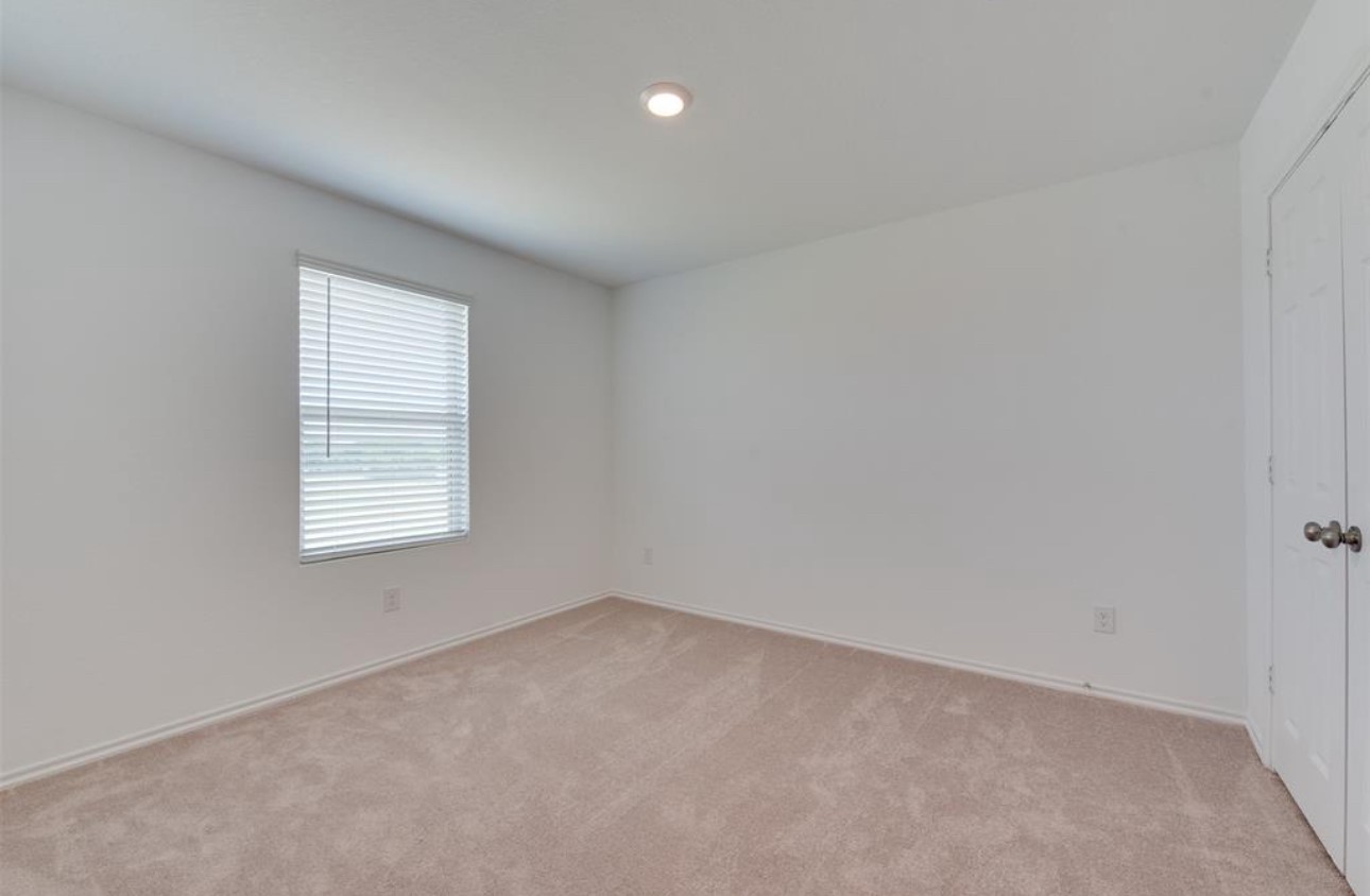 11020 South Lake Mist Lane Willis, TX 77318 - Photo 7 of 27 an empty room with a window