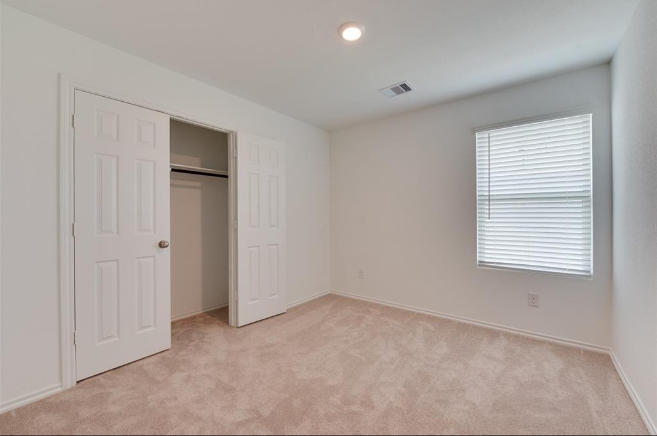 11020 South Lake Mist Lane Willis, TX 77318 - Photo 9 of 27 a view of an empty room with a window