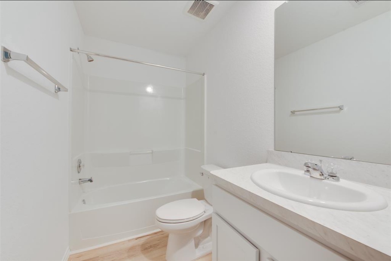 11020 South Lake Mist Lane Willis, TX 77318 - Photo 10 of 27 a bathroom with a sink toilet and shower