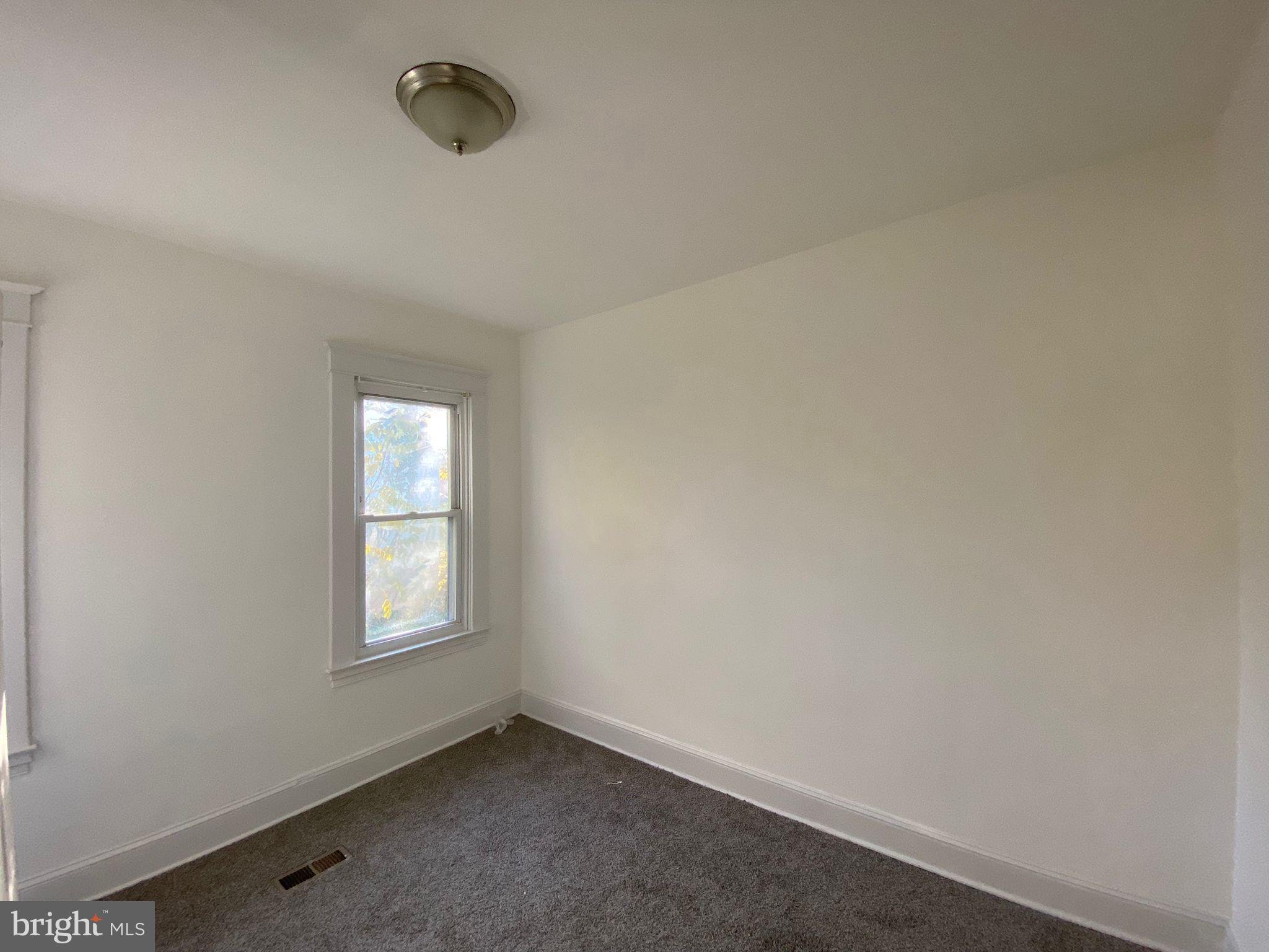 6203 McClean Boulevard Baltimore, MD 21214 - Photo 13 of 26 an empty room with windows