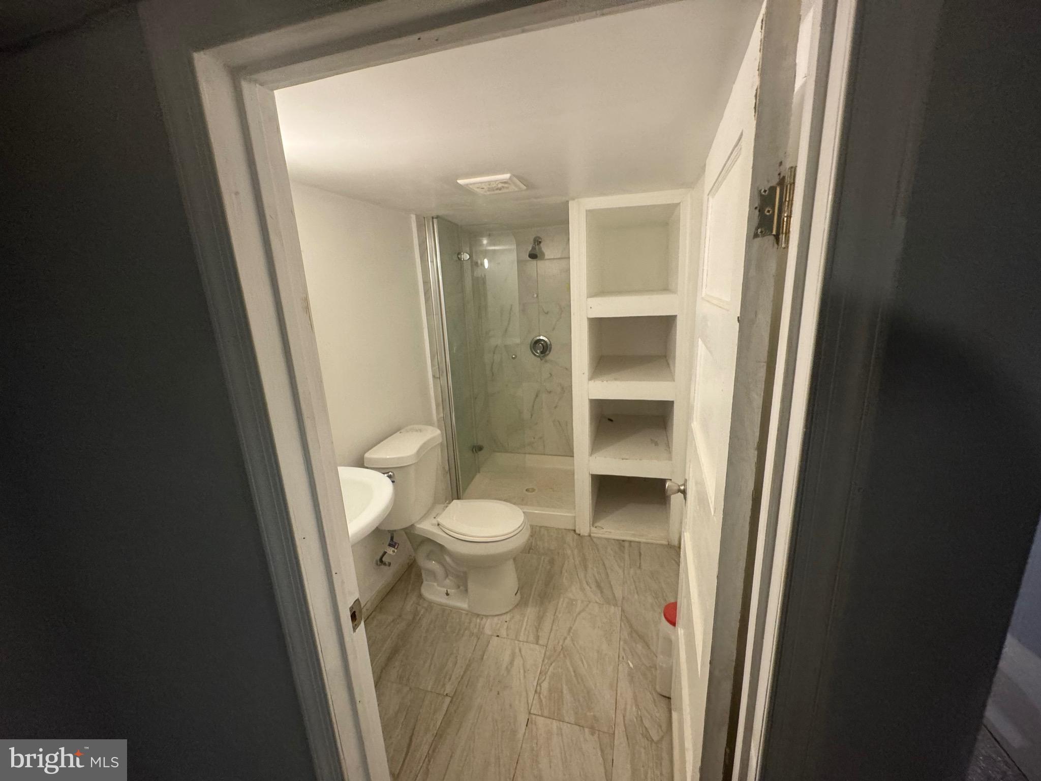 6203 McClean Boulevard Baltimore, MD 21214 - Photo 22 of 26 a bathroom with a toilet and a sink