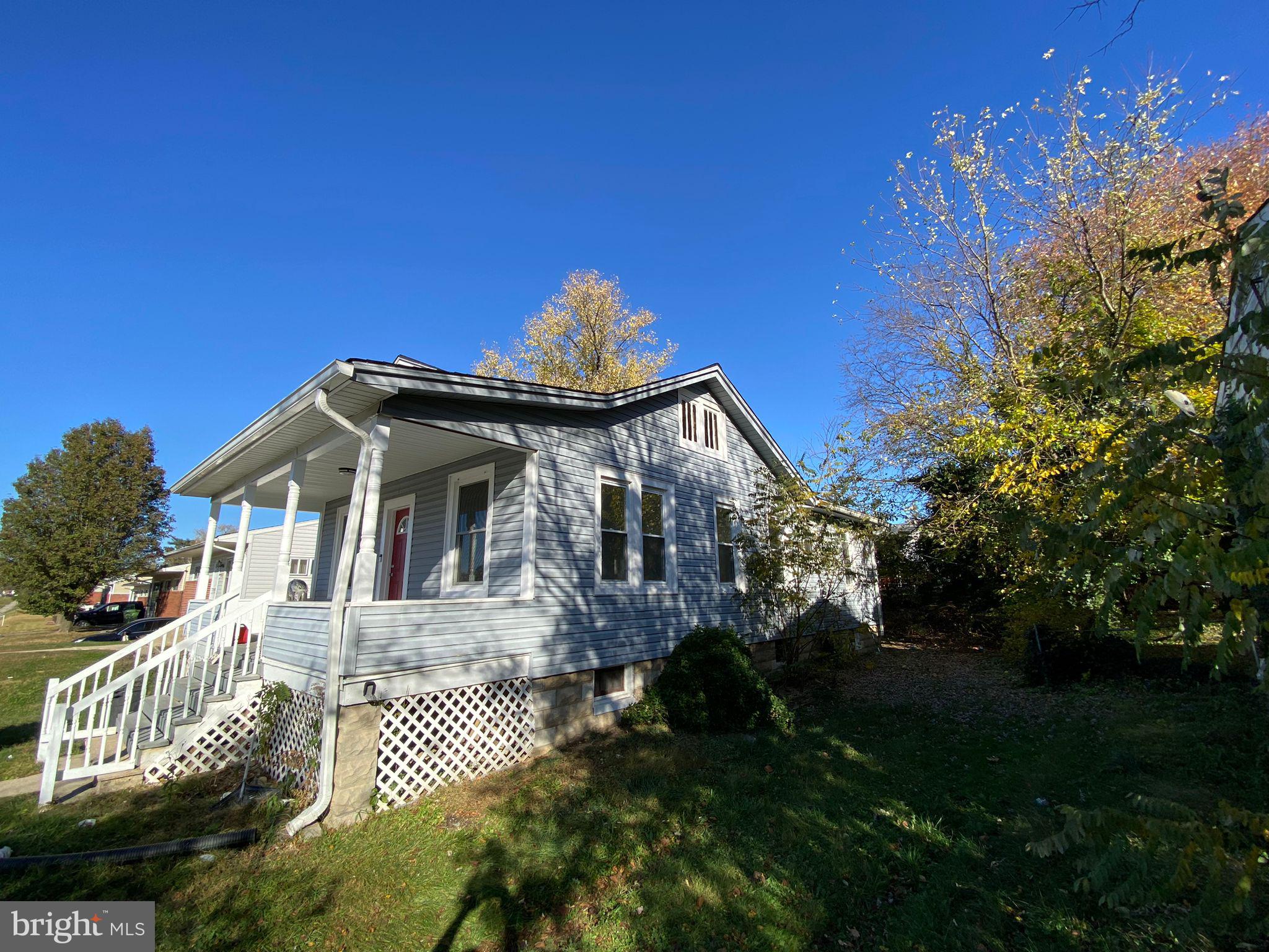 6203 McClean Boulevard Baltimore, MD 21214 - Photo 26 of 26 a front view of a house with a garden