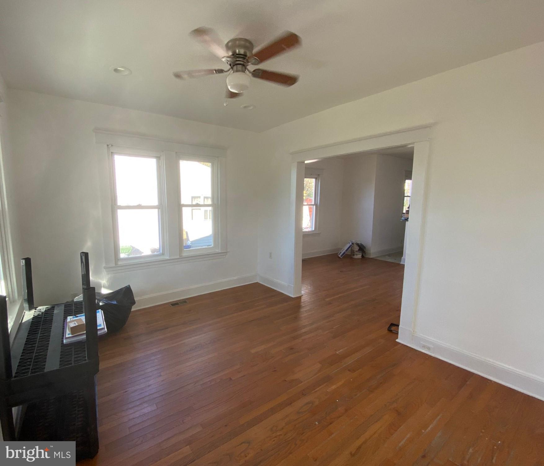 6203 McClean Boulevard Baltimore, MD 21214 - Photo 3 of 26 a view of livingroom with hardwood floor and a ceiling fan