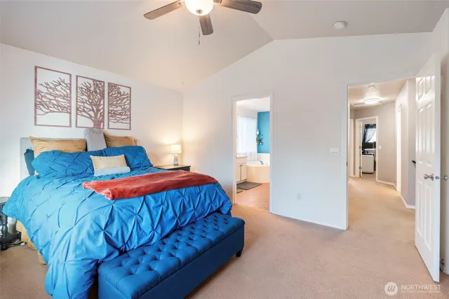a spacious bathroom with a double vanity sink mirror and bathtub