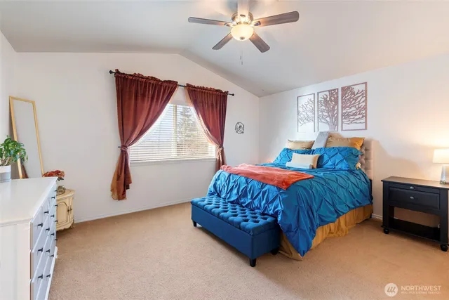 a bedroom with a bed and window