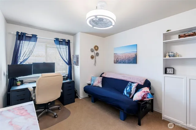 a backyard of a house with wooden floor outdoor seating and yard in the back