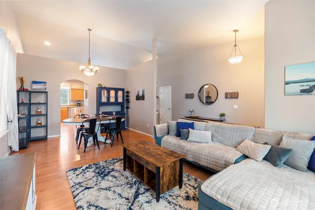 a view of a dining room with furniture and a bookshelf