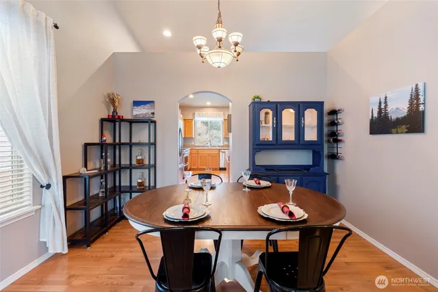 a view of a dining room with furniture and window