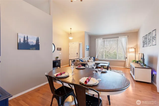 a kitchen with stainless steel appliances granite countertop a refrigerator a stove top oven a sink and dishwasher