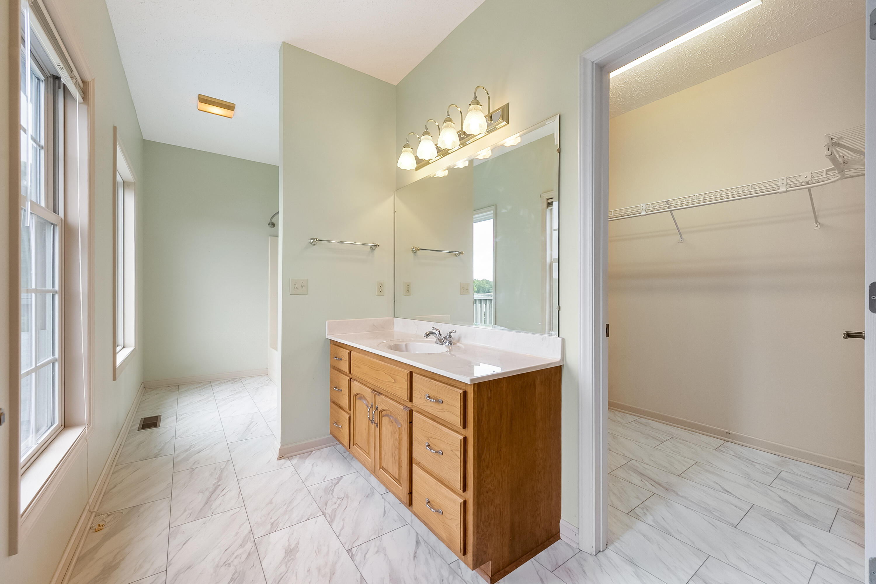 3611 Kemp Ford Road Union Hall, VA 24176 - Photo 48 of 101 a bathroom with a sink a mirror and a shower