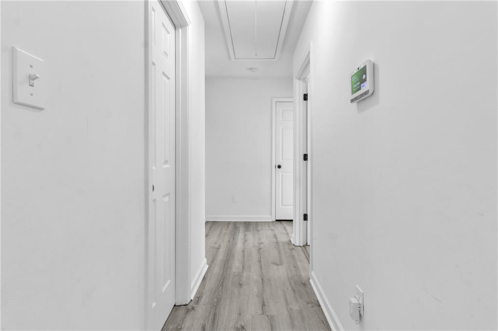 3985 Countryside Way Southwest Snellville, GA 30039 - Photo 15 of 40 a view of a hallway with wooden floor