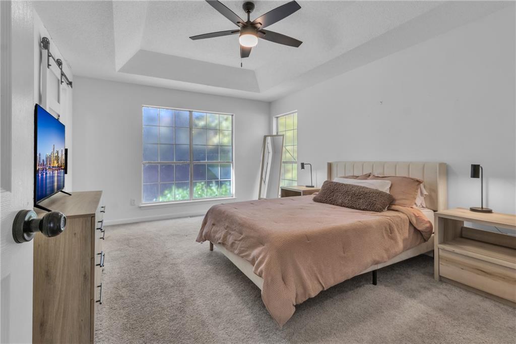 3985 Countryside Way Southwest Snellville, GA 30039 - Photo 18 of 40 a bedroom with a bed and window