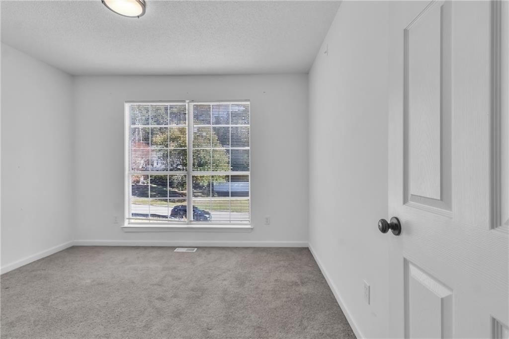 3985 Countryside Way Southwest Snellville, GA 30039 - Photo 25 of 40 an empty room with a window
