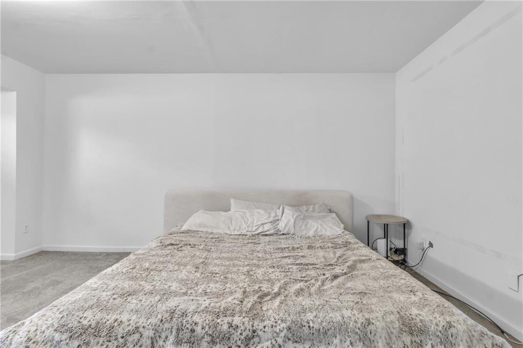 3985 Countryside Way Southwest Snellville, GA 30039 - Photo 29 of 40 a bedroom with a bed and a table