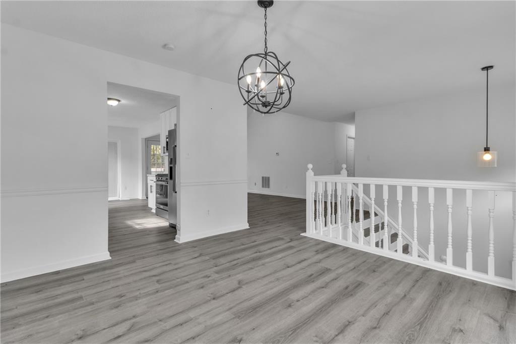 3985 Countryside Way Southwest Snellville, GA 30039 - Photo 3 of 40 a view of a room with wooden floor